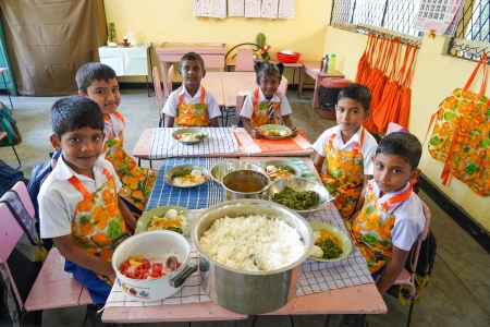 Primary grade students in Sri Lanka enjoying their morning school meal supported by the World Food Programme