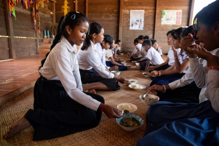 Children eat lunch at school in Cambodia