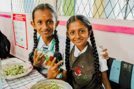 "School meal programme Sri Lanka - students enjoying their morning school meals"